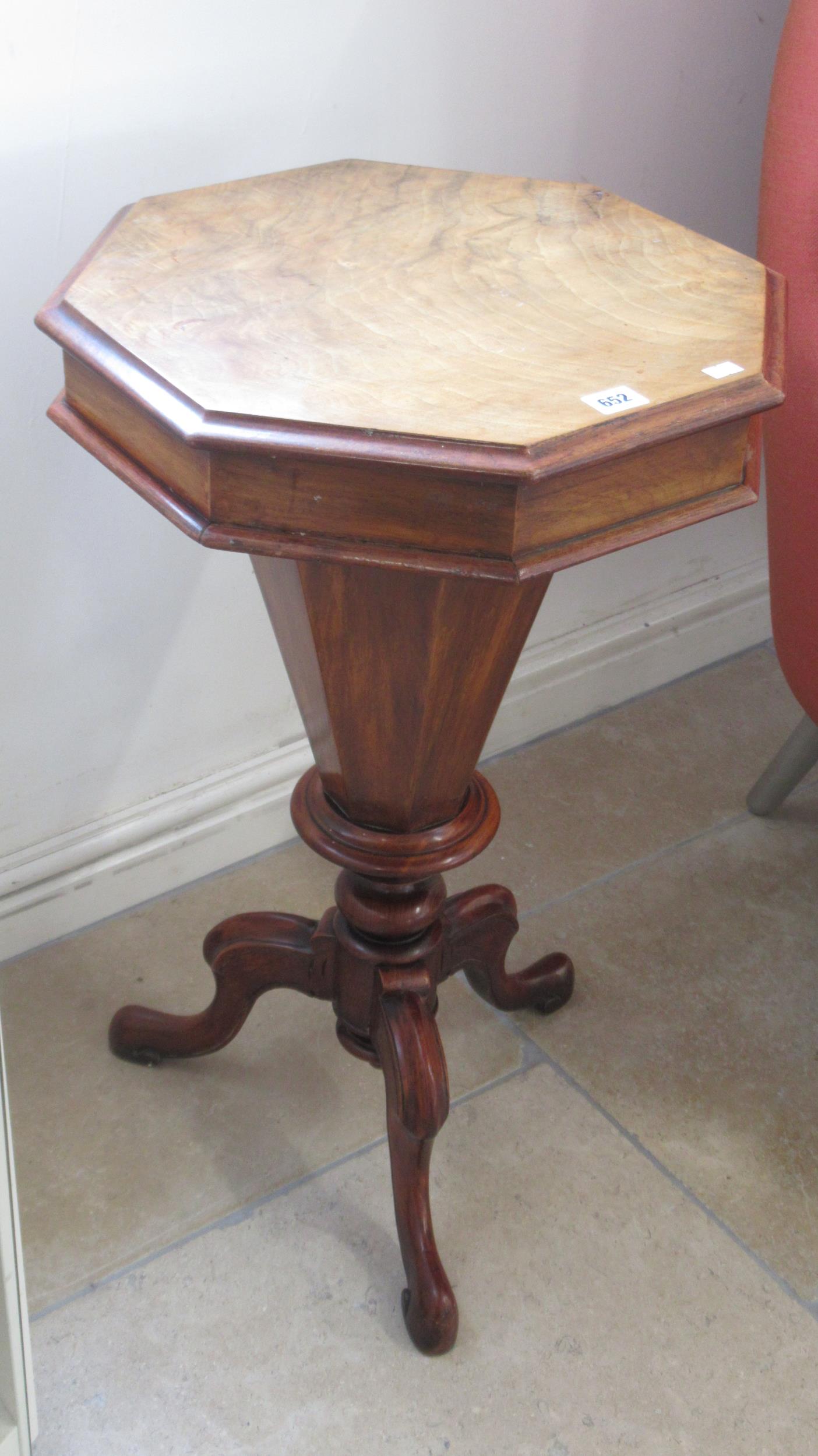 A Victorian walnut trumpet shaped needlework table with fitted interior