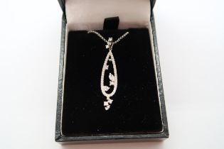 An 18ct white gold diamond pendant - ex jewellers stock, as new condition - RRP £750