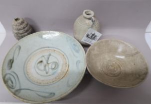A ring handled bottle from shipwrecked Royal Nanhai Cargo AD1450, 12cm high, with one smaller