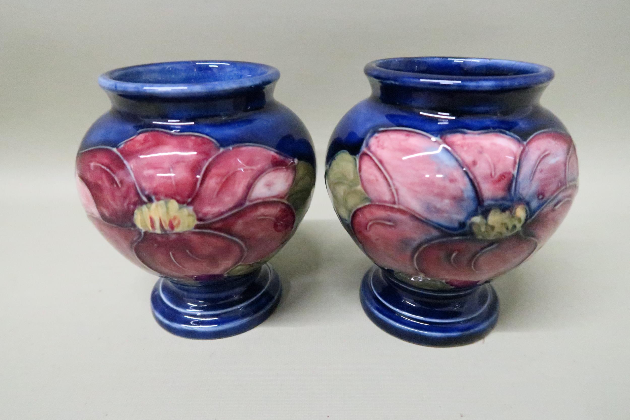 Moorcroft Pottery - Two items, blue background - approx Height 9cm x Diameter 8cm