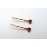 A pair of 18ct Yellow Gold drop earrings with oval cut amethysts, approx. 3.9 grams.