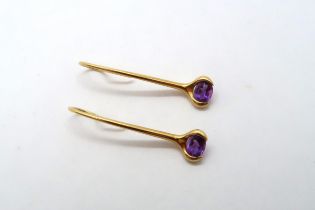 A pair of 18ct Yellow Gold drop earrings with oval cut amethysts, approx. 3.9 grams.