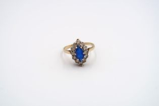 Two 9ct gold rings. To include a sapphire and diamond cluster ring and a paste set marquise shape