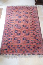 A vintage Afghan rug, 195cm x 127cm