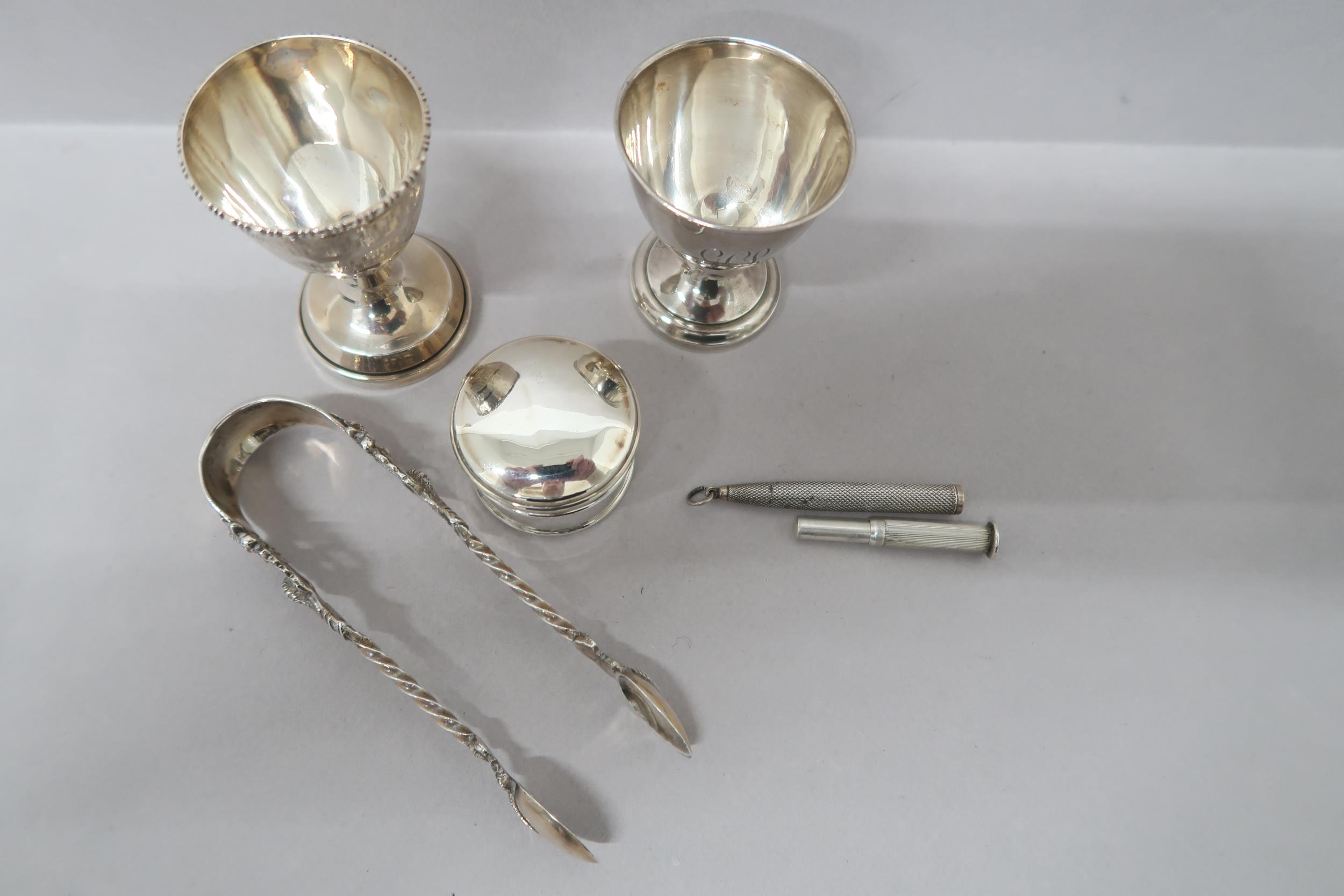 Two silver Christening egg cups, pill box and sugar nips along with a silver propelling pencil, - Image 2 of 2