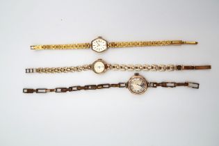 A ladies 9ct gold cased wristwatch on 9ct gold strap along with two 9ct gold watch cases.