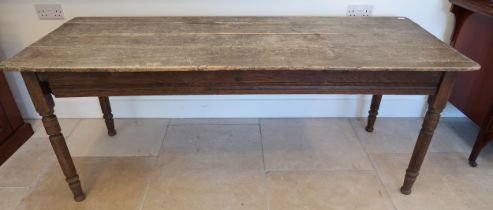 A rustic pine table on turned legs, 182cm long x 72cm wide