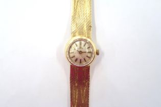 A ladies Omega wristwatch with an 18ct gold strap - approx weight 37.9 grams