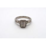 A paladium Art Deco style diamond cluster ring with diamond shoulders, head size approx 9mm x 8mm,