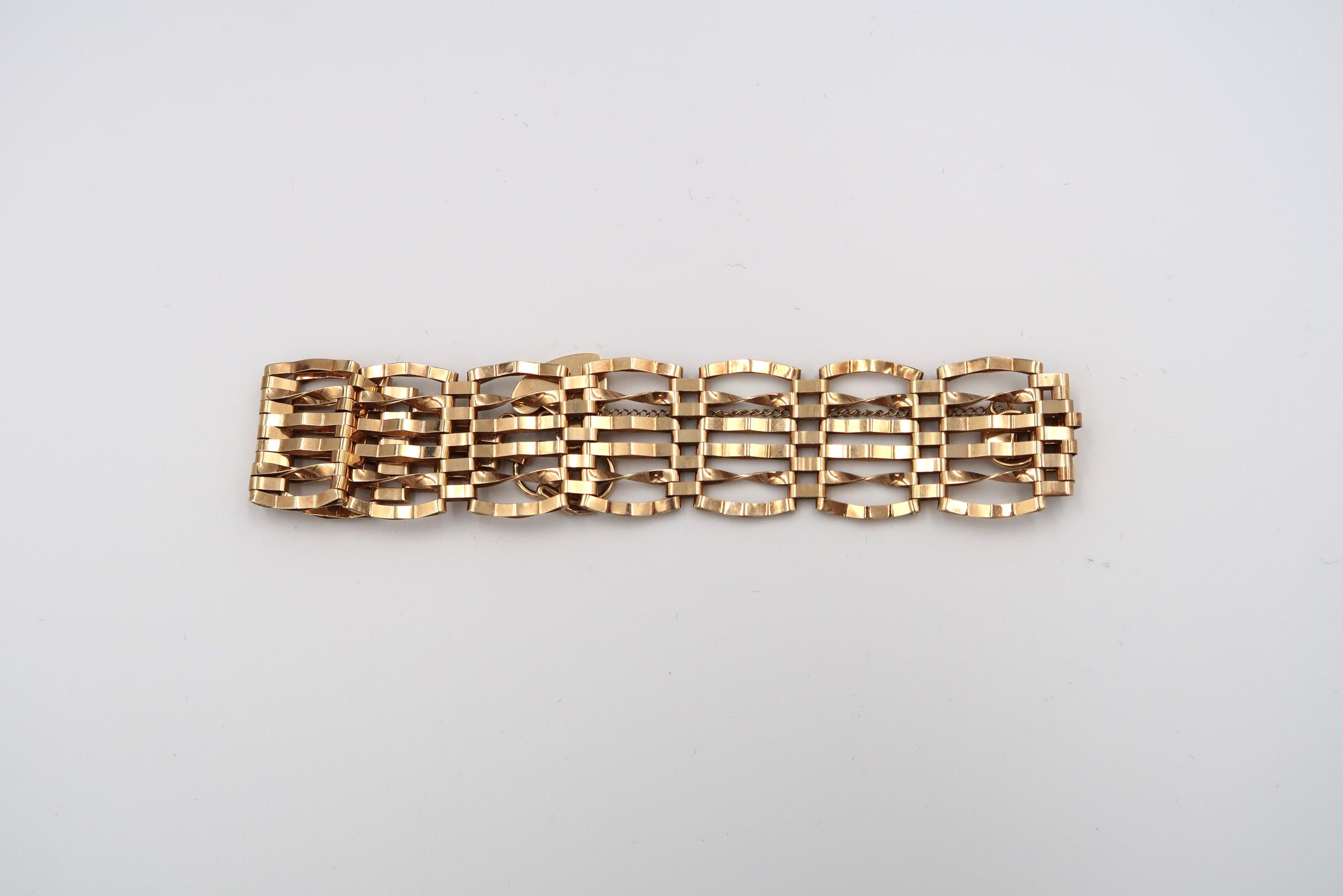 A 9ct gold articulated bracelet with heart lock - approx weight 13.31 grams