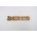 A 9ct gold articulated bracelet with heart lock - approx weight 13.31 grams