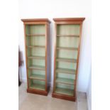 A pair of slim walnut bookcases with five adjustable shelves - 180cm x 52cm x 26cm deep- made by a