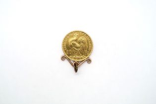 A 1913 gold 20 Franc coin in a mount - total weight approx 7 grams