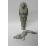 A white metal crocodile, 16.5cm in length, a stoneware sarcophagus decorated with hydroglyphics