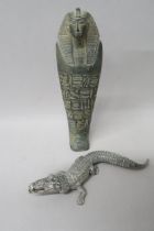 A white metal crocodile, 16.5cm in length, a stoneware sarcophagus decorated with hydroglyphics