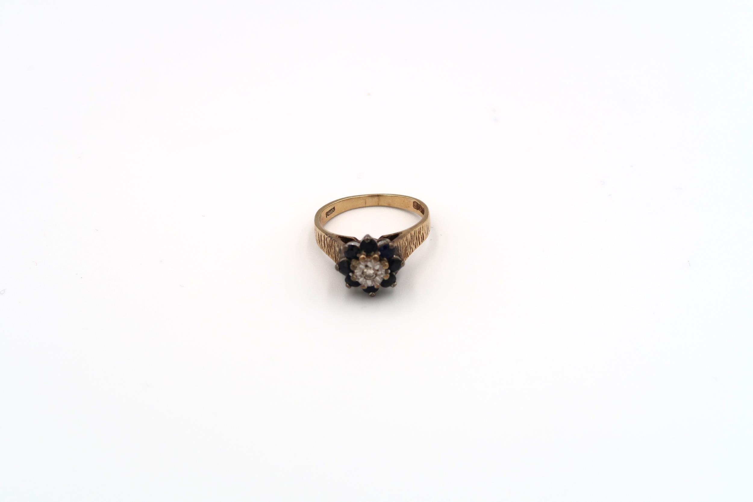 A 9ct gold sapphire and single cut diamond cluster ring with bark effect shoulders. Weight 3.49 - Image 4 of 6