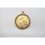 A Victorian sovereign dated 1898 in a gold mount - total weight approx 10.5 grams