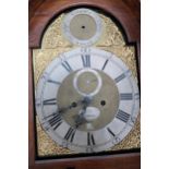 An 8 day Grandfather clock with a brass dial with a plaque for Hanson London, in an oak case with