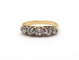 A ladies 18ct yellow gold ring set with five old cut diamonds - ring size P - estimated total