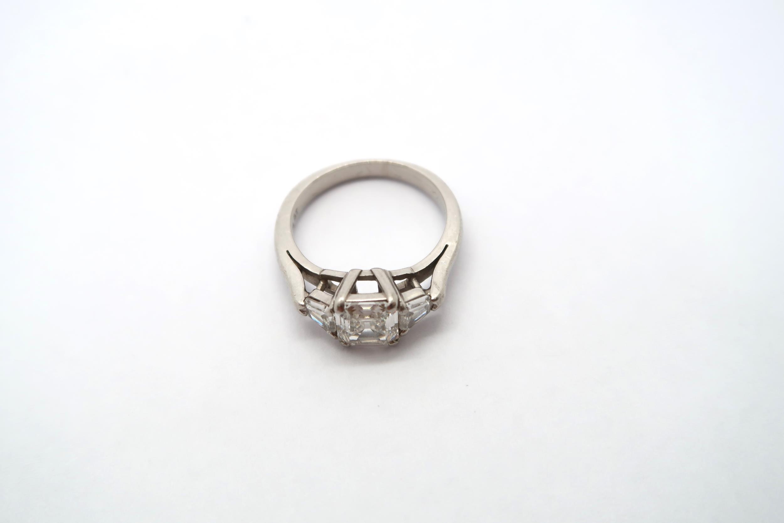 A very good platinum three stone diamond ring - The square emerald cut diamond estimated 1.1ct - Image 5 of 11