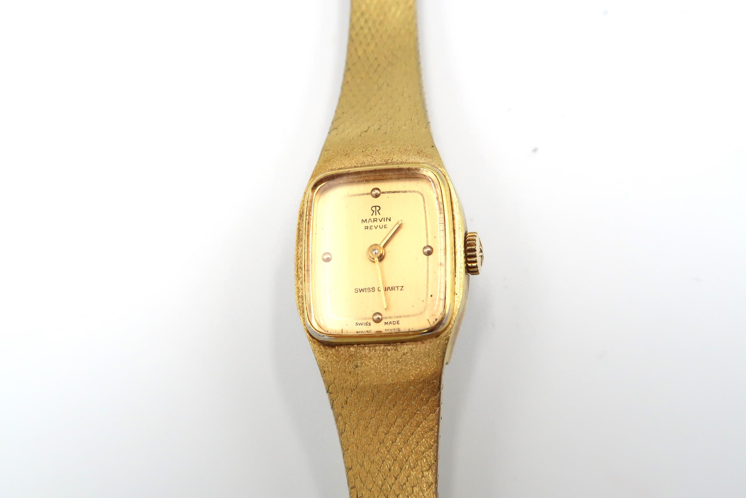 A ladies Marvin watch with gold plated strap and case