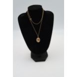 A 9ct yellow gold oval locket on necklace chain, approx 60cm, a crucifix, pisces pendant, approx 7