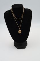 A 9ct yellow gold oval locket on necklace chain, approx 60cm, a crucifix, pisces pendant, approx 7