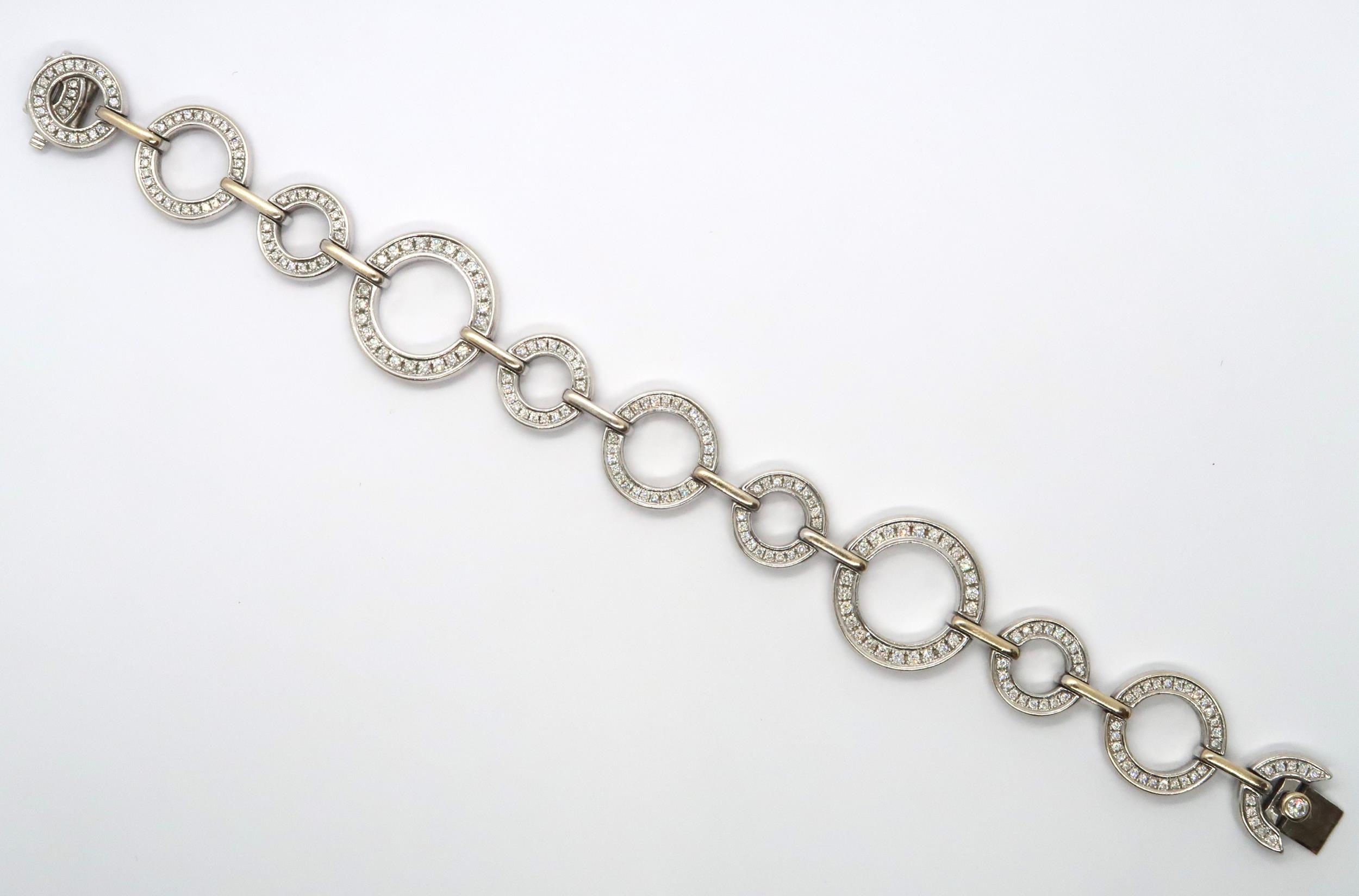 An 18ct white gold diamond set Boodles 'Roulette' bracelet, grain set with round brilliant cut