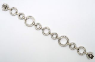 An 18ct white gold diamond set Boodles 'Roulette' bracelet, grain set with round brilliant cut