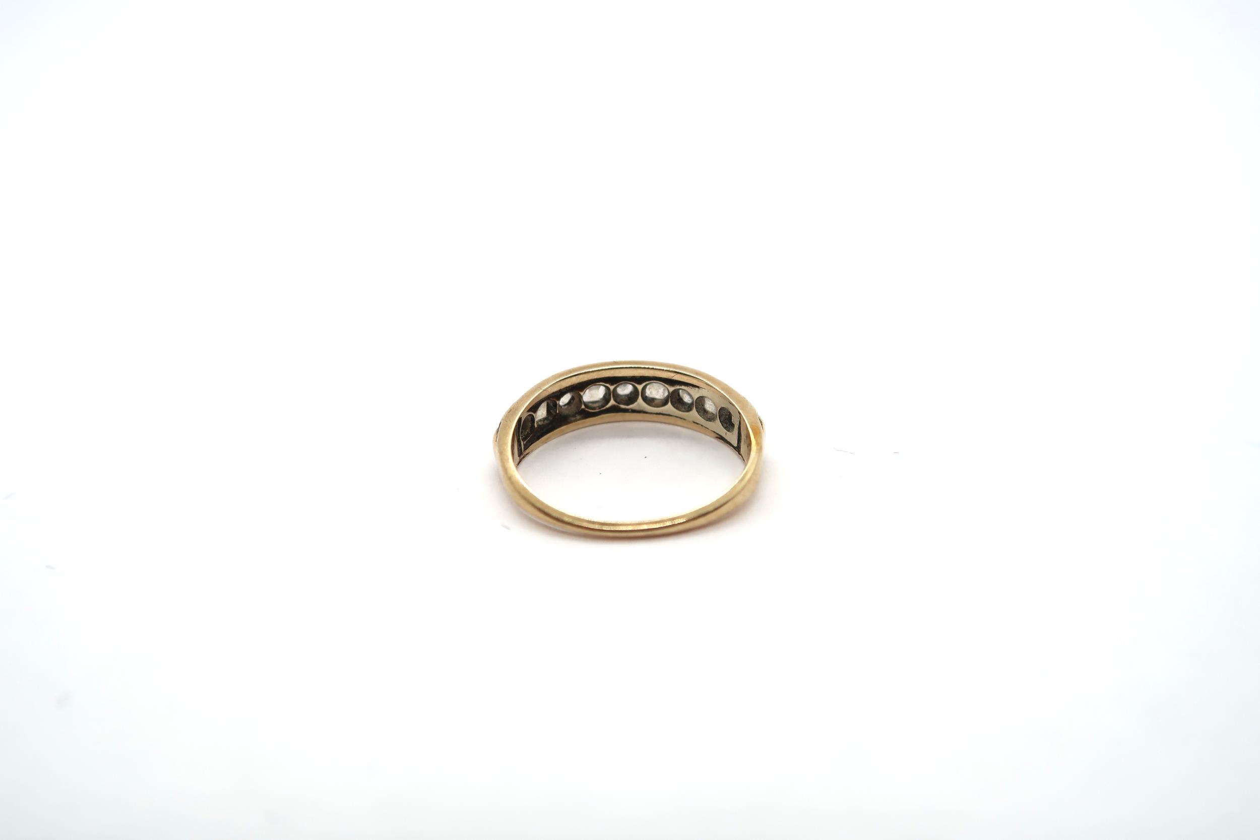 A 9ct yellow gold ring set with 9 white sapphires to shoulder, size J, approx 1.8 grams - Image 3 of 3