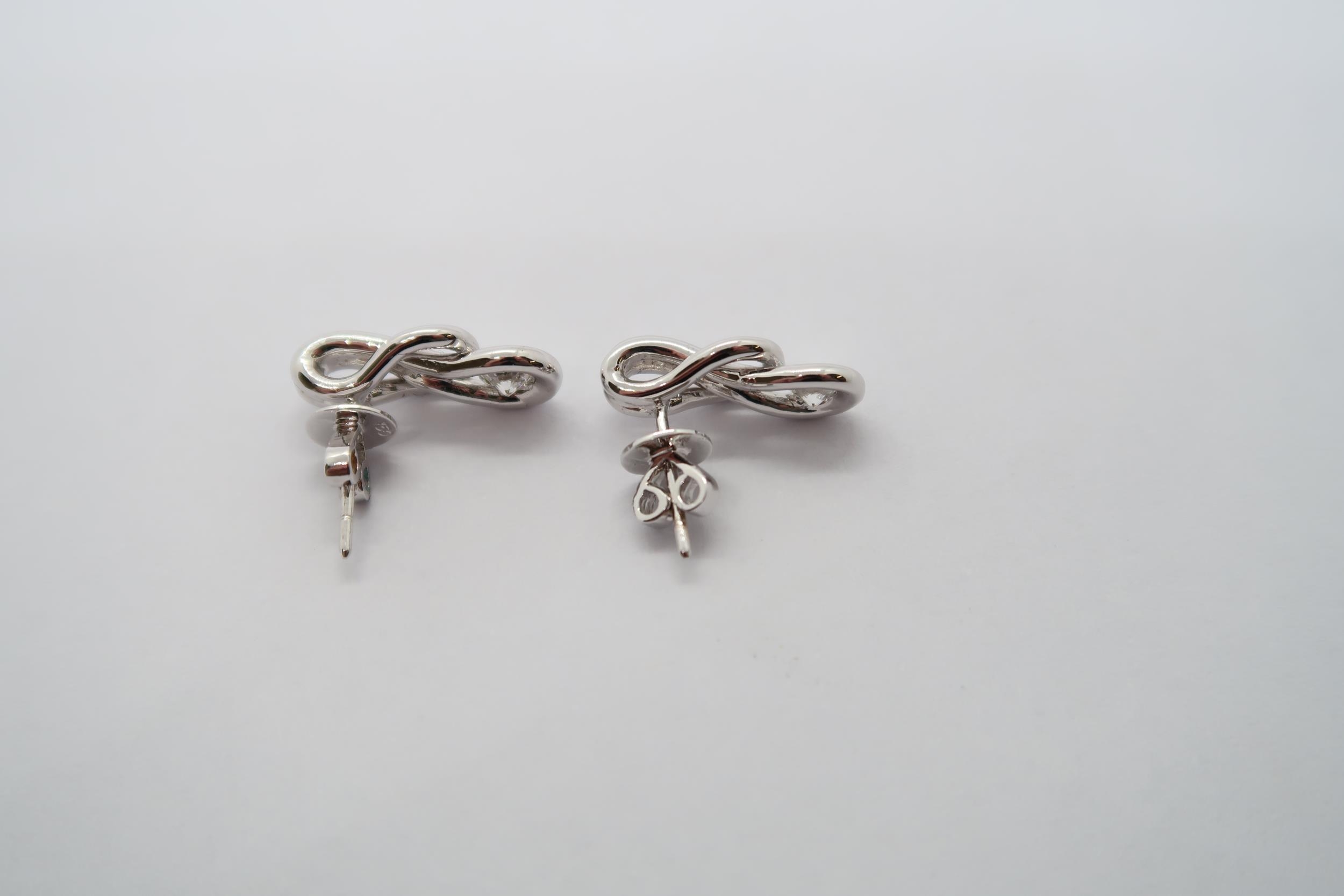 A pair of good quality 18ct white gold diamond Love Knot earrings, colour approx G/H, VS1, head size - Image 2 of 2