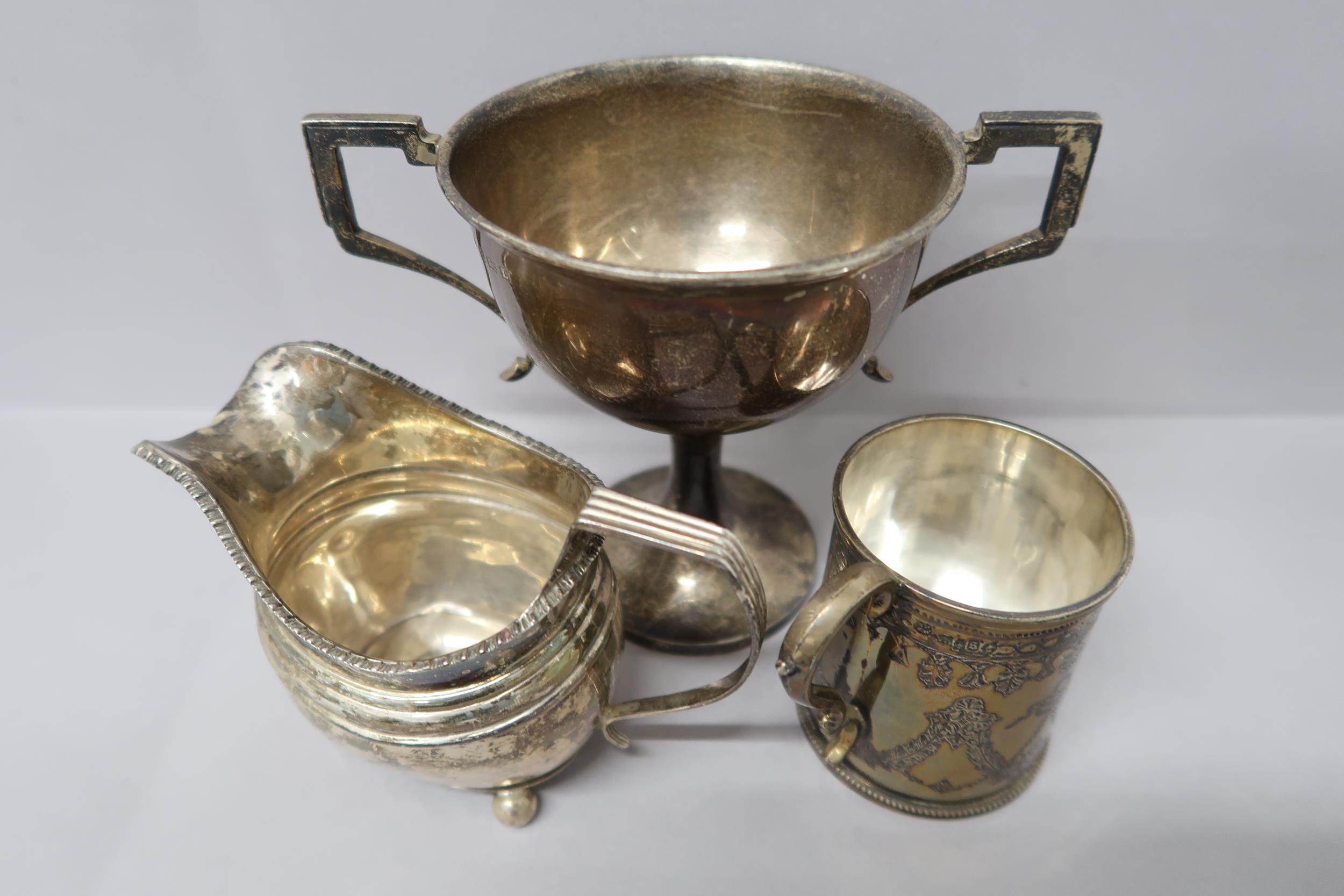 A hallmarked silver cup decorated with bows and swags, London 1873 Martin Hall & Co, and a silver - Image 2 of 2