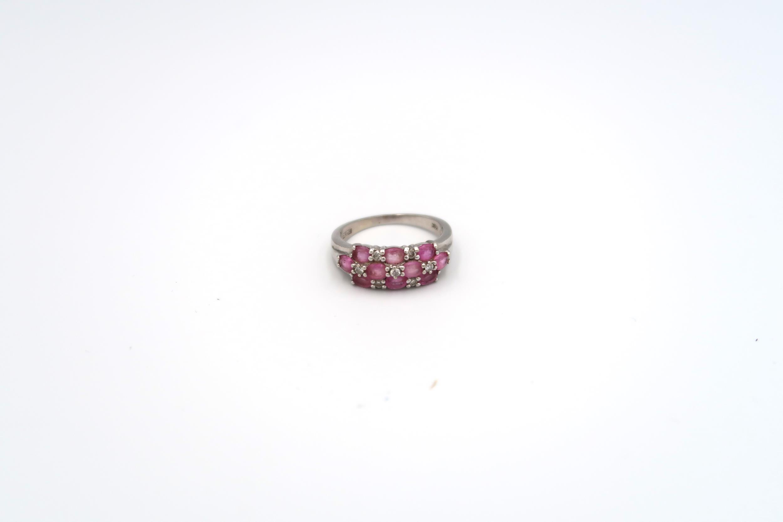A 14ct white gold ring with pink sapphire, size Q, approx 4.8 grams