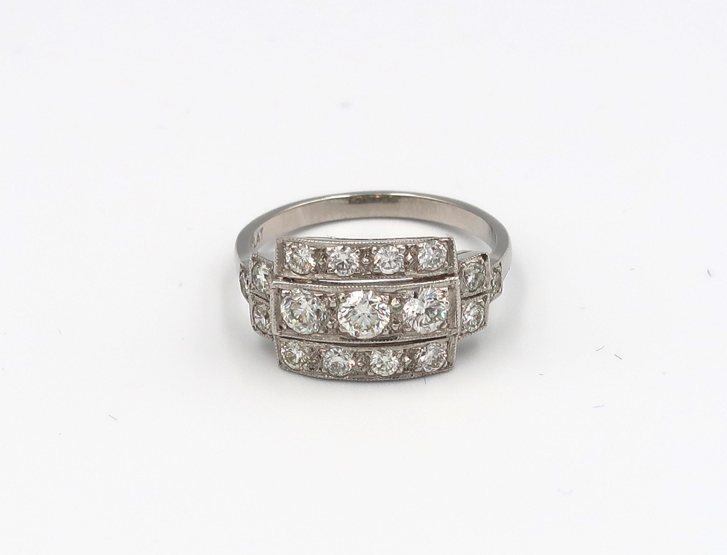 An Art Deco style platinum three row diamond ring with diamond shoulders - diamond weight approx 1.