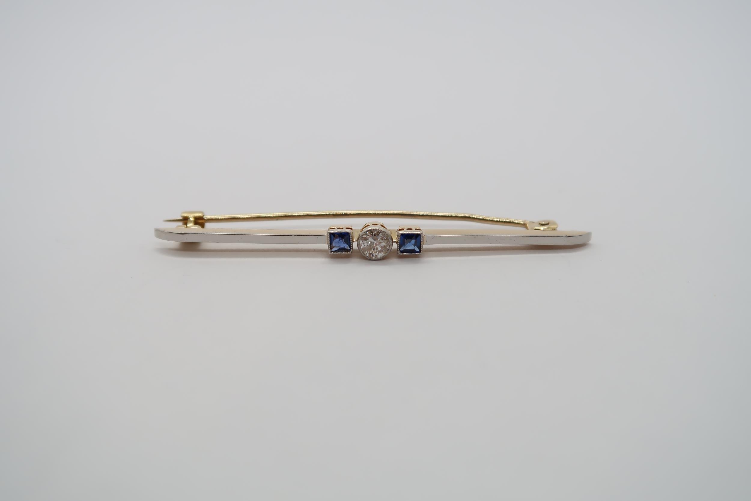 A platinum and 18ct yellow gold Art Deco diamond and sapphire bar brooch