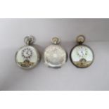 Three pocket watches, one silver Hunter in working order, one nickel and one gunmetal