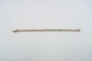 A 9ct yellow and white gold bracelet with small diamonds to top - weight approx 5.7 grams - length