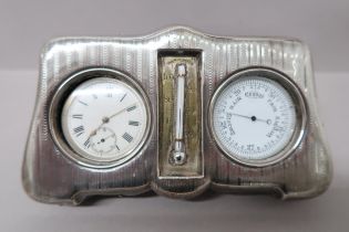 A silver hallmarked desk clock, thermometer, mercury and barometer all held in silver desk stand -