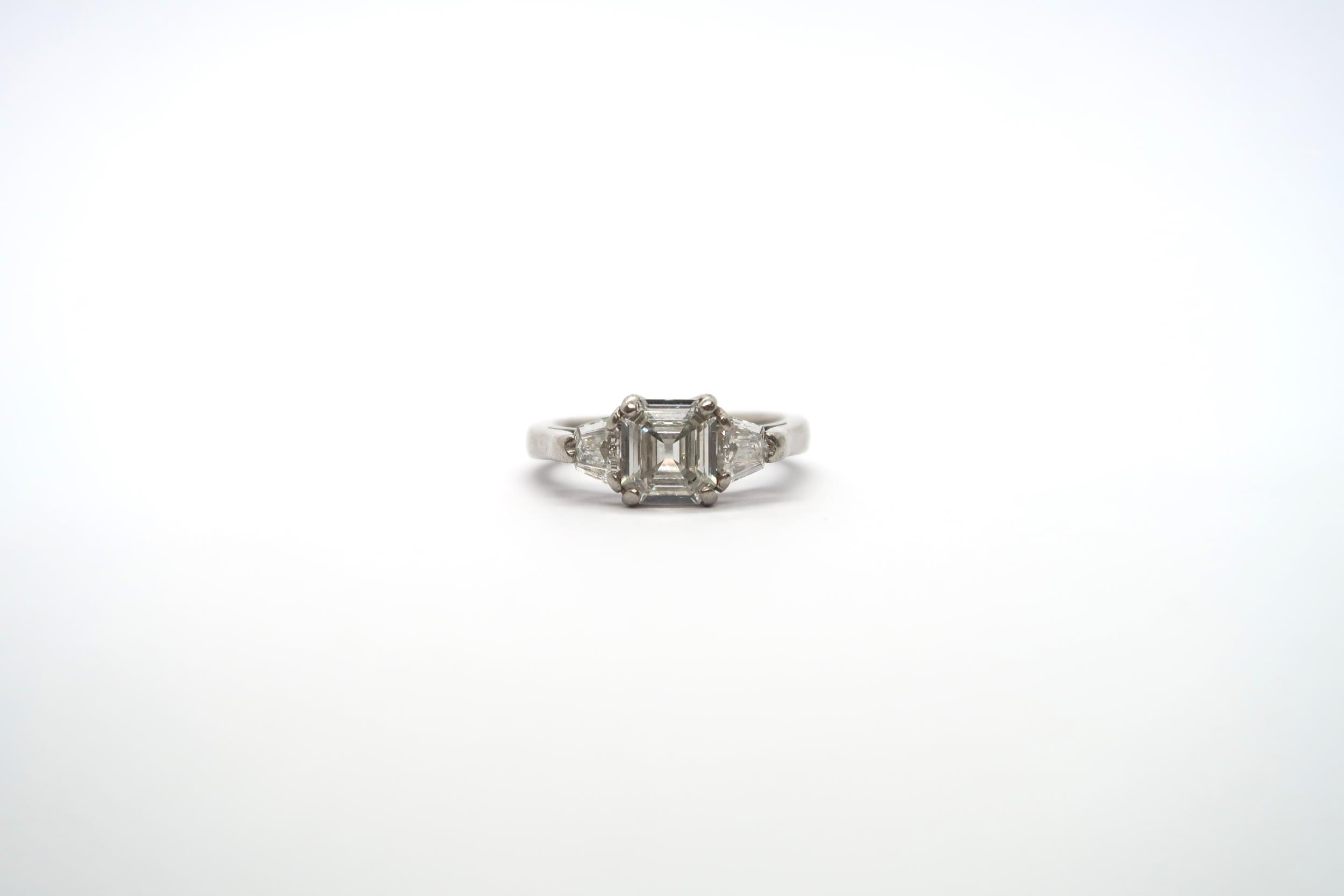 A very good platinum three stone diamond ring - The square emerald cut diamond estimated 1.1ct - Image 9 of 11