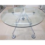 A Norman Foster circular glass topped table with chrome legs - Diameter 120cm x Height 75cm