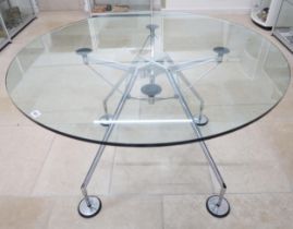 A Norman Foster circular glass topped table with chrome legs - Diameter 120cm x Height 75cm