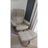 A Stressless Mayfair medium chair and stool, oak frame, with beige leather upholstery