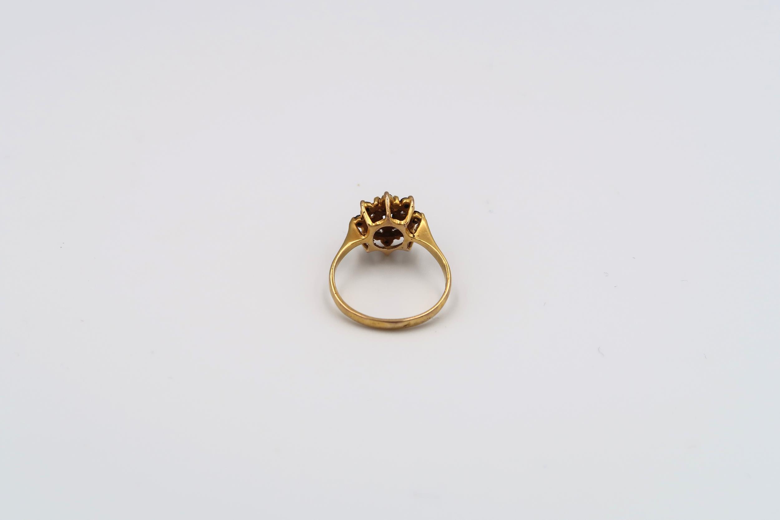 A 9ct gold sapphire and single cut diamond cluster ring with bark effect shoulders. Weight 3.49 - Image 3 of 6