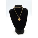 Two 9ct gold pendants on necklace chains, total weight 8.5 grams.