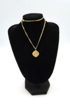 Two 9ct gold pendants on necklace chains, total weight 8.5 grams.