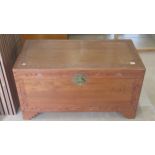 A camphor wood lined blanket box carved, brass lock, 100cm wide x 50cm deep x 54cm high