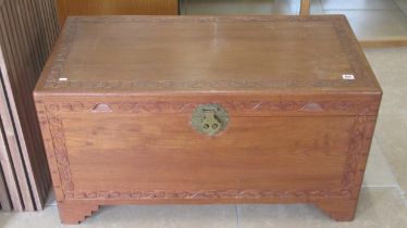 A camphor wood lined blanket box carved, brass lock, 100cm wide x 50cm deep x 54cm high