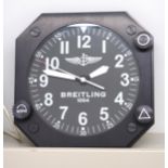 A Breitling advertising wall clock finished in black lacquer metal. 27.8cm across face.