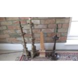 A collection of Altar candlesticks and mahogany table lamp base - height of largest 66cm
