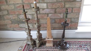 A collection of Altar candlesticks and mahogany table lamp base - height of largest 66cm